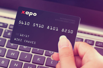 debit card xapo bitcoin launch month report vaults wsj debuts cards customers its